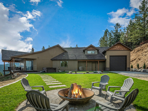 A home with a fire pit in the yard.