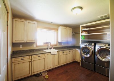 A laundry room with a washer and dryer.
