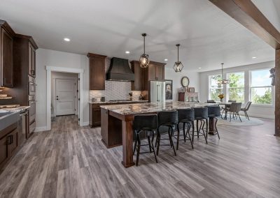 A large kitchen with hardwood floors and a center island.