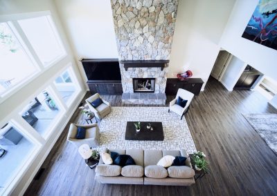 An aerial view of a living room with a fireplace.