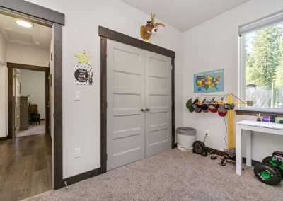 A child's room with toys and a door.