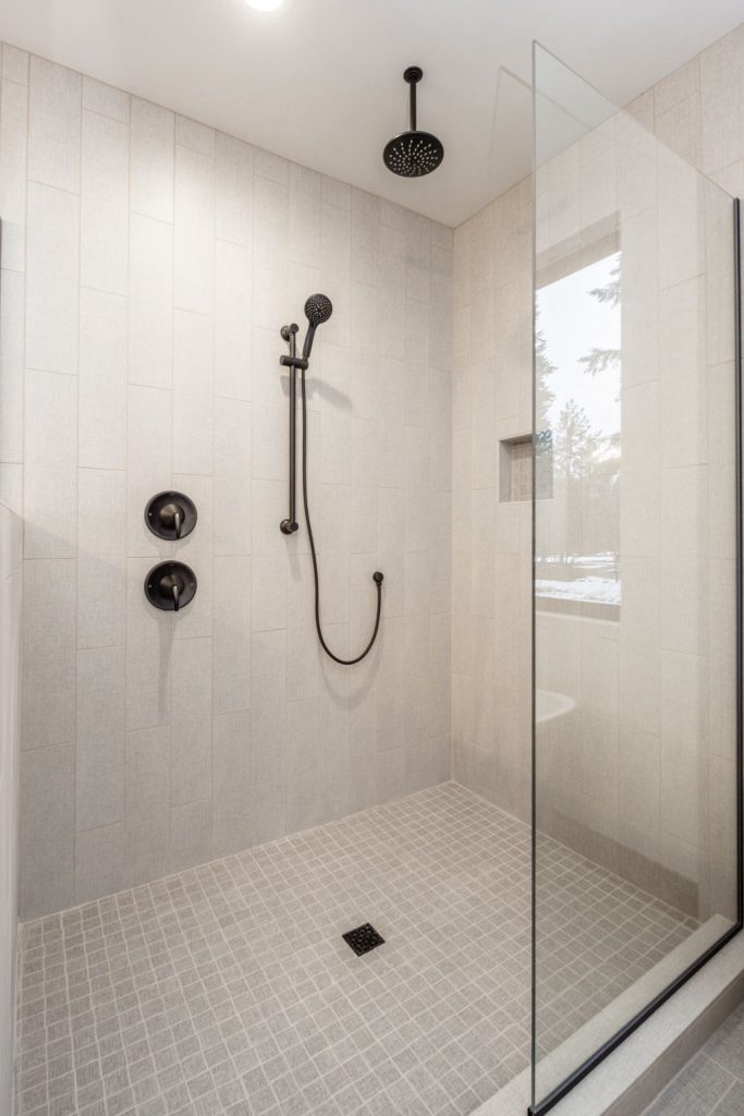 A modern bathroom with a glass shower stall.