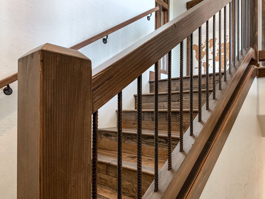 A wooden stair railing in a home.