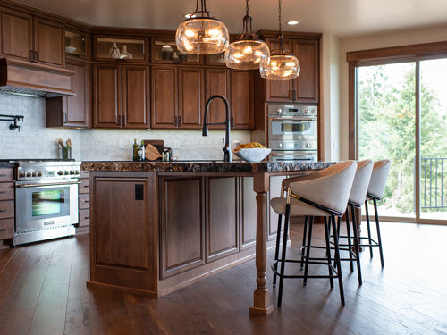 A kitchen with wooden cabinets and a center island.