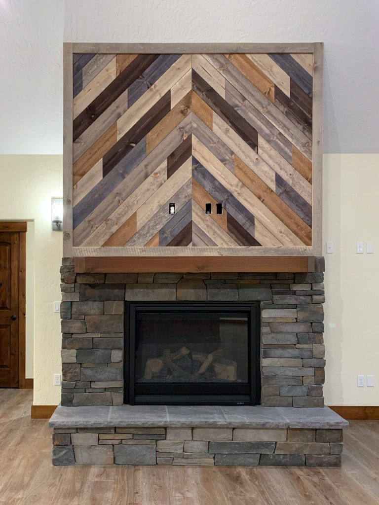 A fireplace with a herringbone pattern on it.