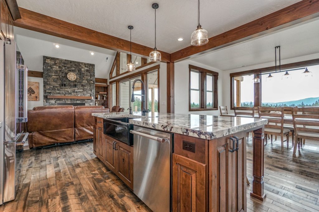 A large kitchen with wood floors and a large island.