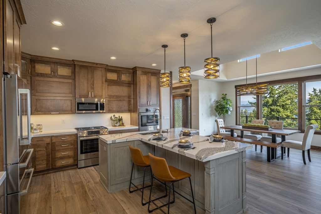 A large kitchen with wood cabinets and a center island.