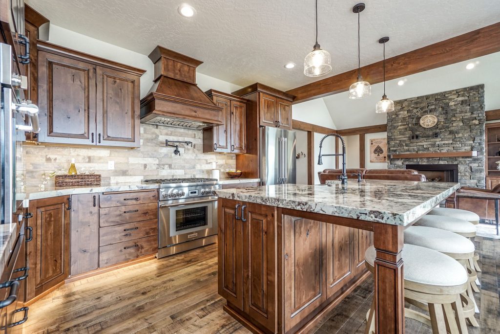 A large kitchen with wood cabinets and granite counter tops.