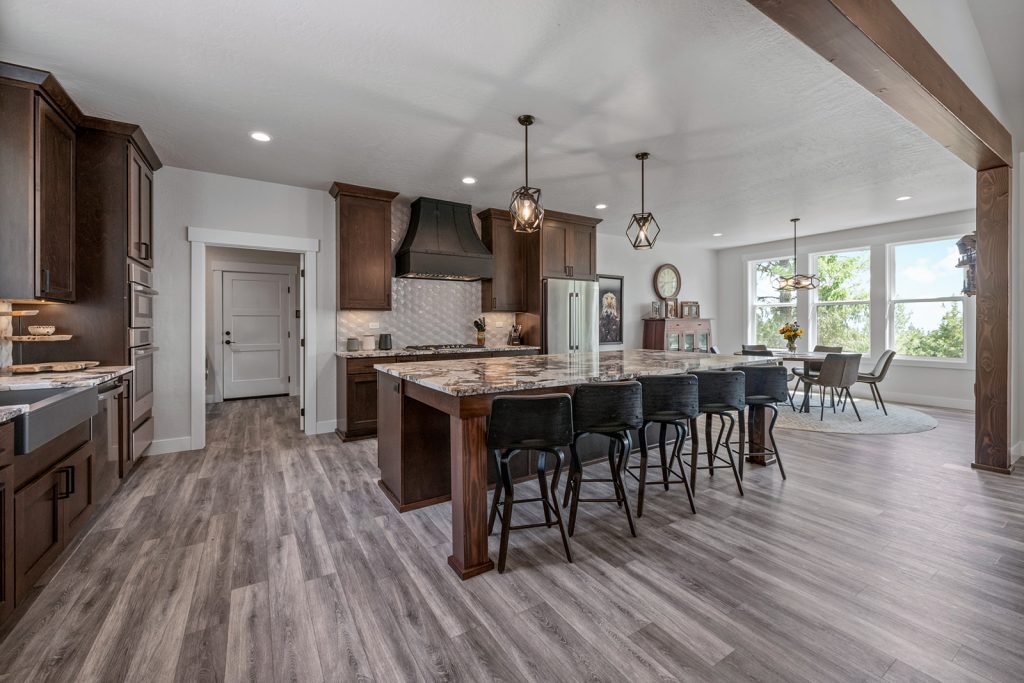 A large kitchen with hardwood floors and a center island.